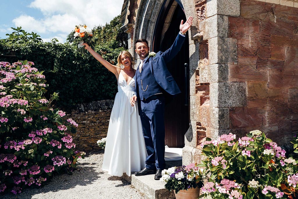 bride and groom outside of church in st mawes