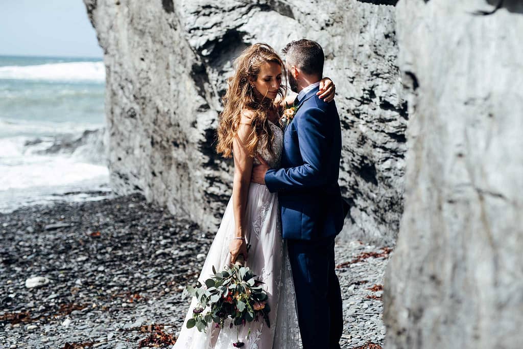 Bride and groom on Devon beach