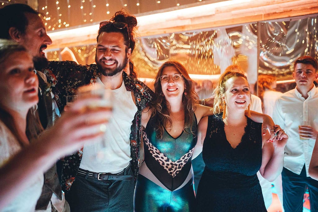 Guests dancing at a festival wedding in devon
