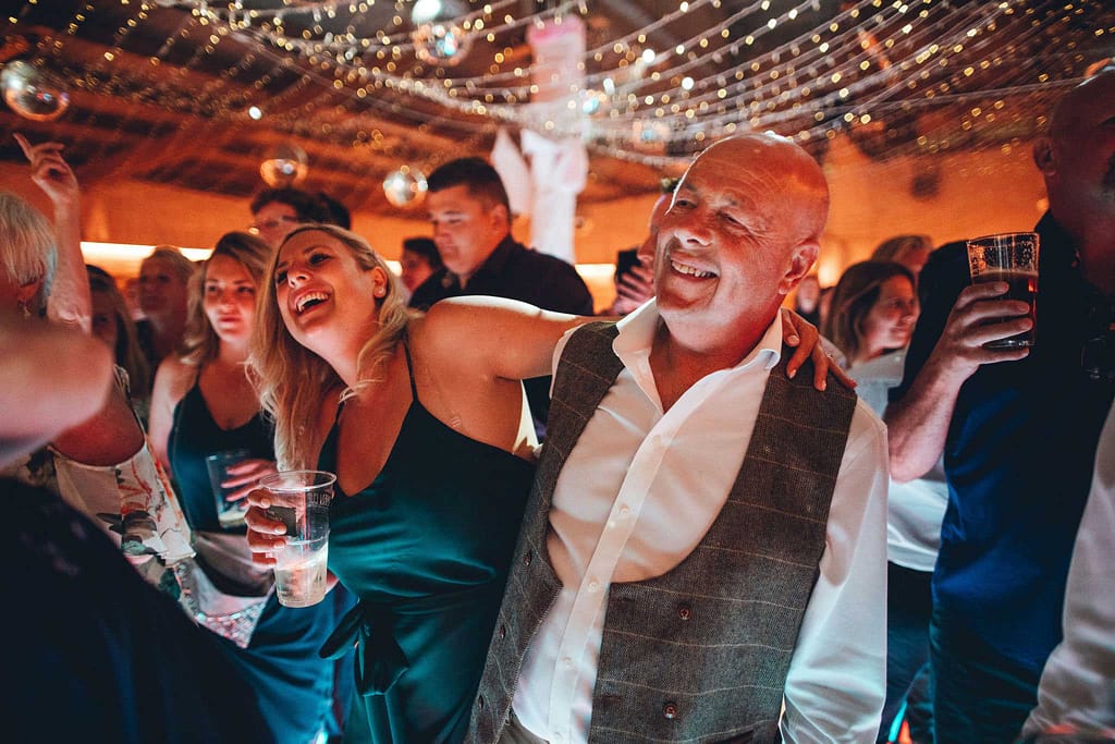 Guests dancing at a festival wedding in devon