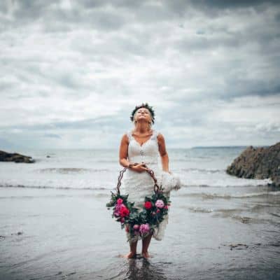 Bride on beach in Cornwall